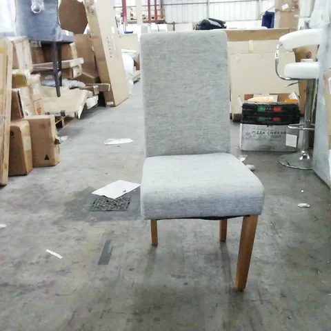 GREY UPHOLSTERED DINING CHAIR - 1 LEG MISSING