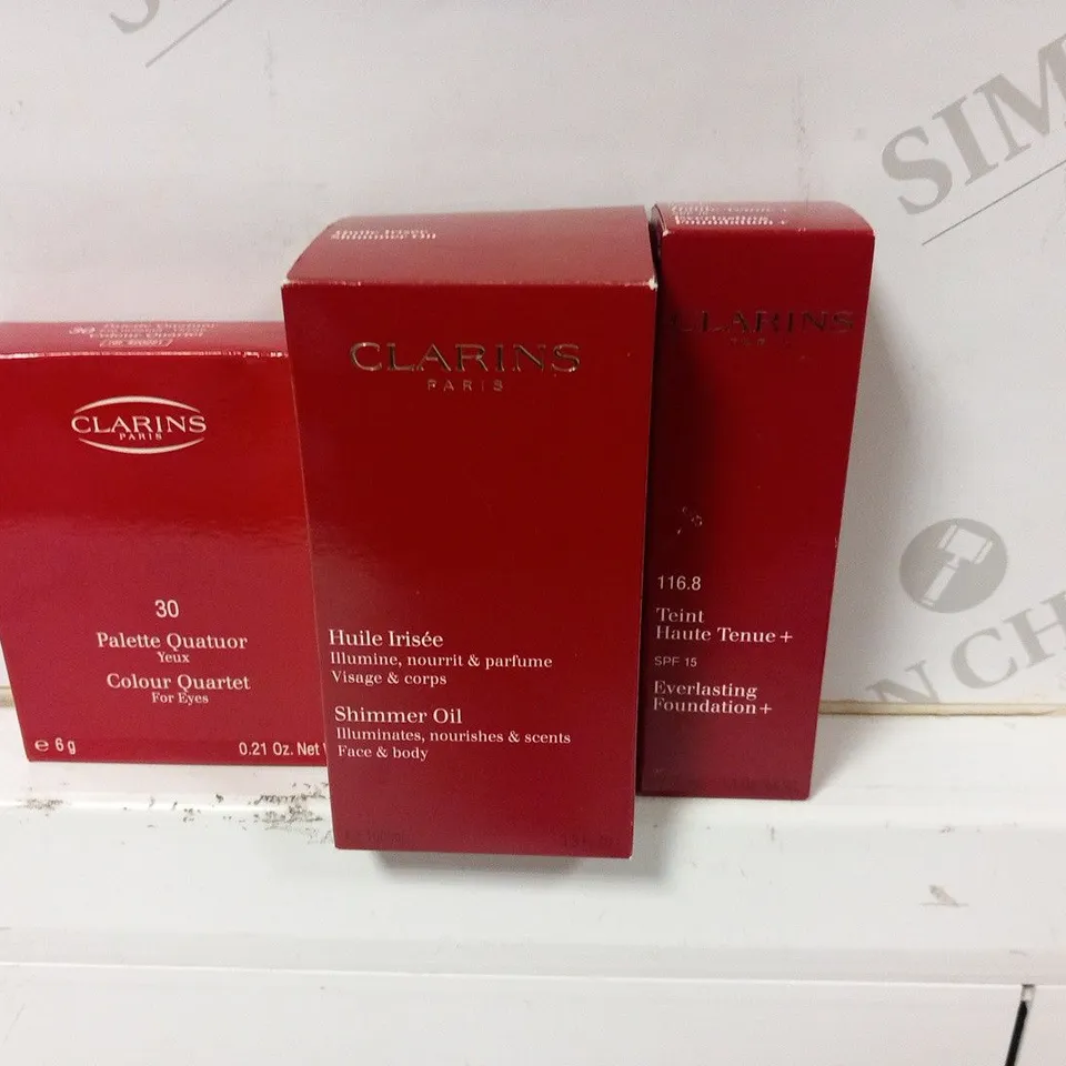 APPROXIMATELY 41 ASSORTED CLARINS PARIS COSMETICS PRODUCTS TO INCLUDE; COLOUR QUARTET FOR EYES 6G, SHIMMER OIL 100ML AND EVERLASTING FOUNDATION + 30ML