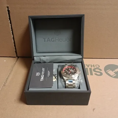 TAG HEUER STAINLESS STEEL CHRONOGRAPH WATCH – BLACK DIAL, RED TACHYMETER BEZEL