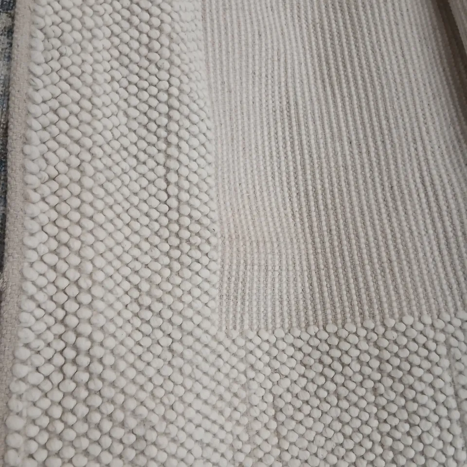 LARGE CREAM BOBBLE RUG WITH BORDER EFFECT