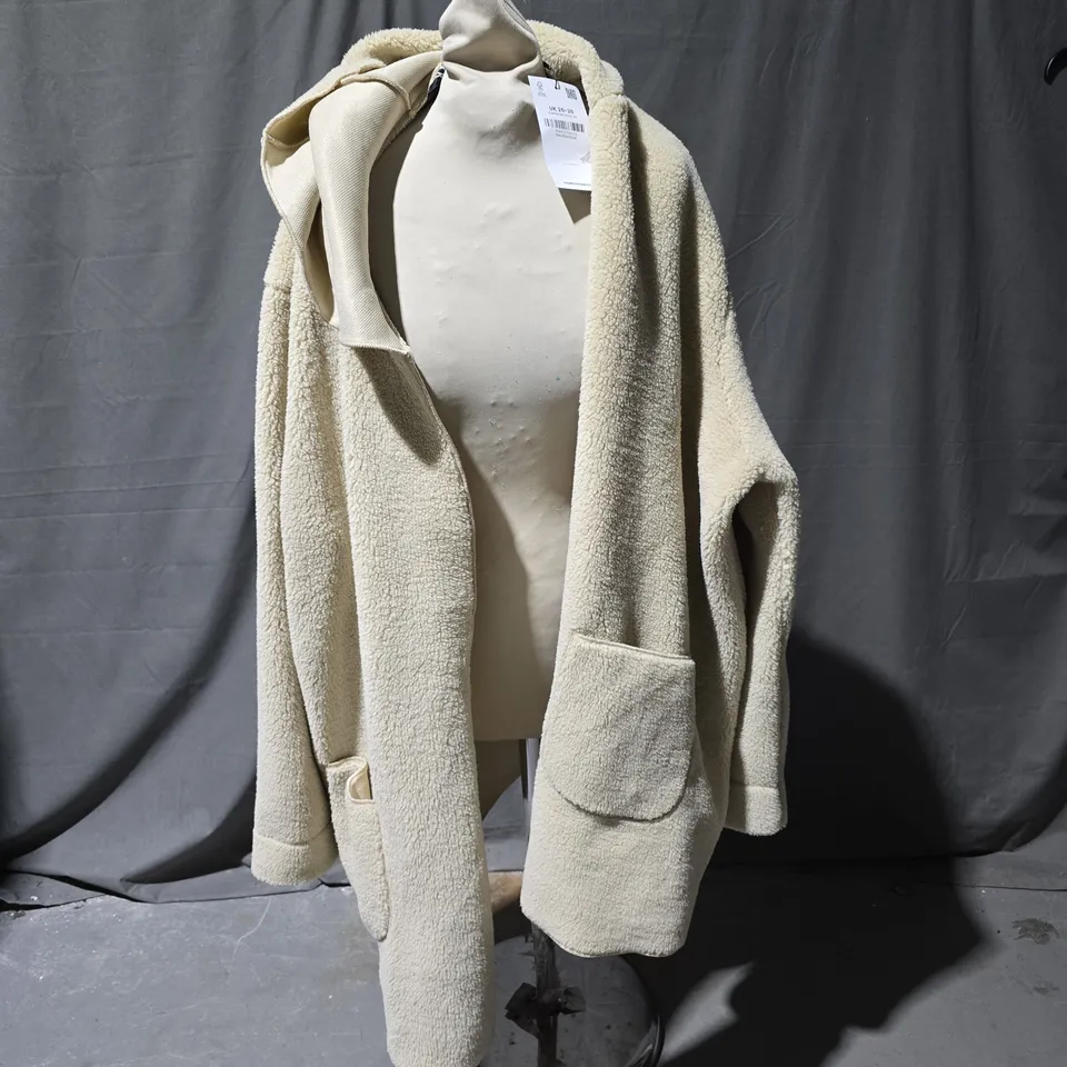 BOX OF APPROXIMATELY 25 ASSORTED CLOTHING ITEMS TO INCLUDE: YOURS BEIGE HOODED FLEECE, UNBRANDED TRACKSUIT BOTTOMS AND FUR LINED BLACK PARKA.