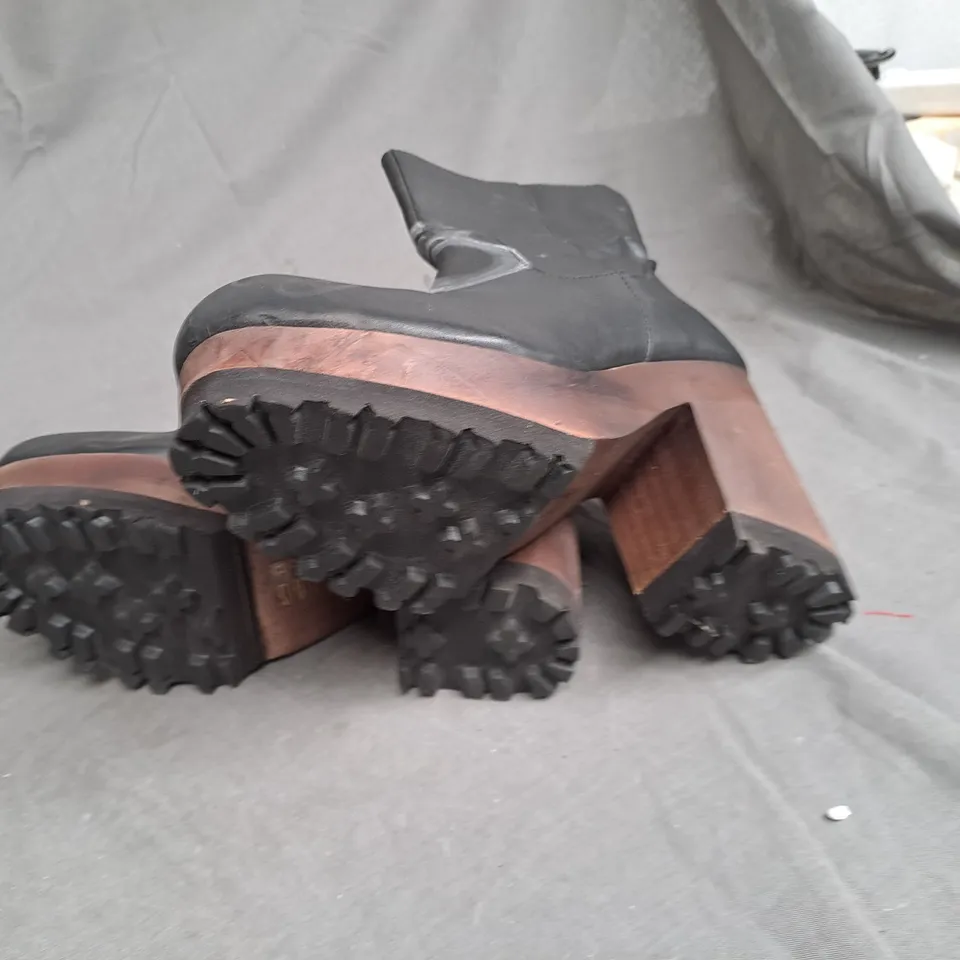 BOX OF APPROXIMATLY 6 WOODEN BOTTOM LEATHER BOOT VARIOUS SIZES 