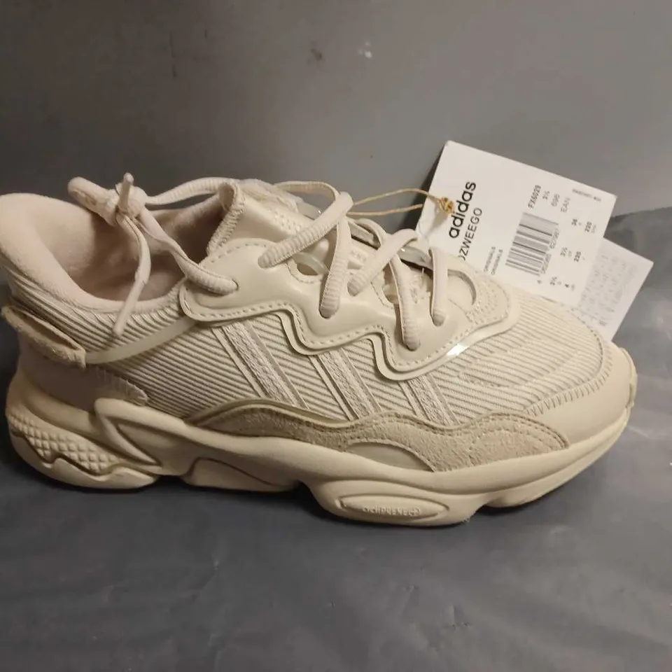 ADIDAS OZWEEGO TRAINERS IN CREAM - UK 3.5