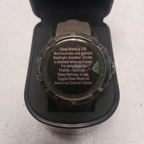COROS smartwatch – round face with tan strap