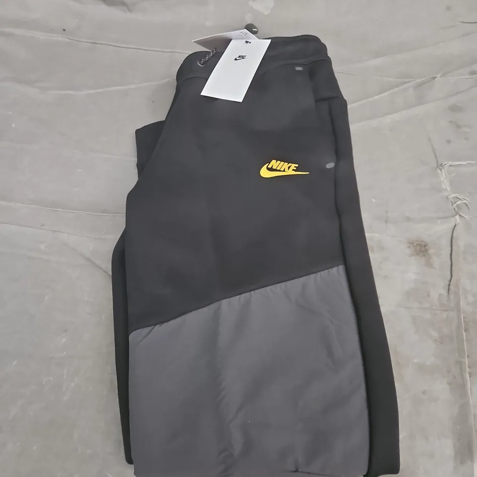 NIKE TECH TRACKSUIT BOTTOMS - KIDS - LARGE