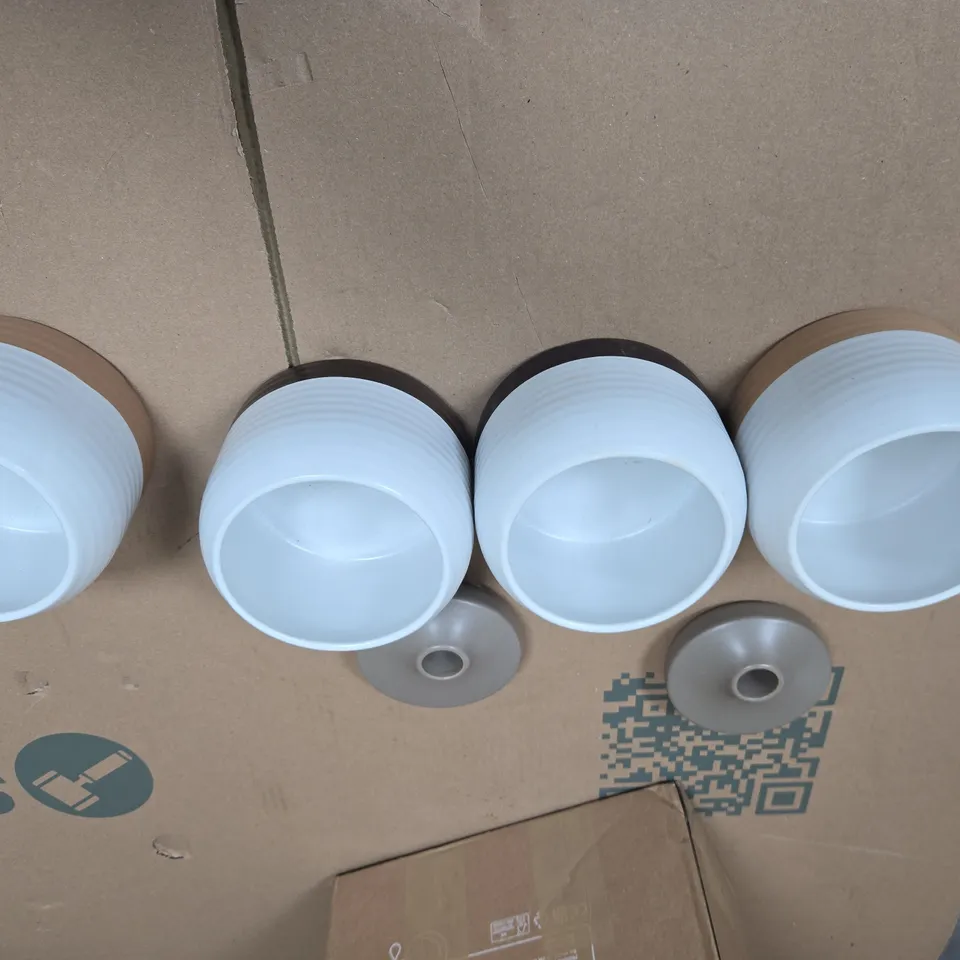 SET OF FOUR JARS WITH TWO LIDS 