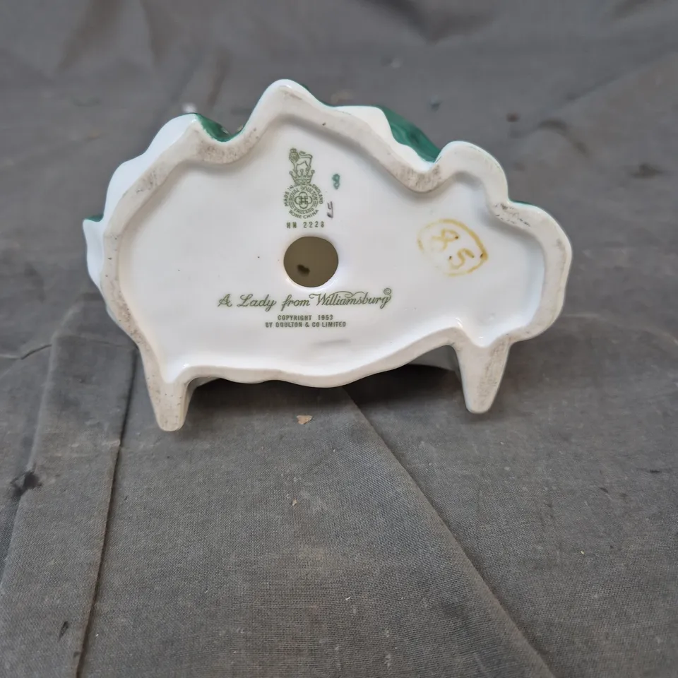 DOULTON & CO PORCELAIN FIGURINE – 'A LADY FROM WILLIAMSBURG', SEATED IN GREEN GOWN