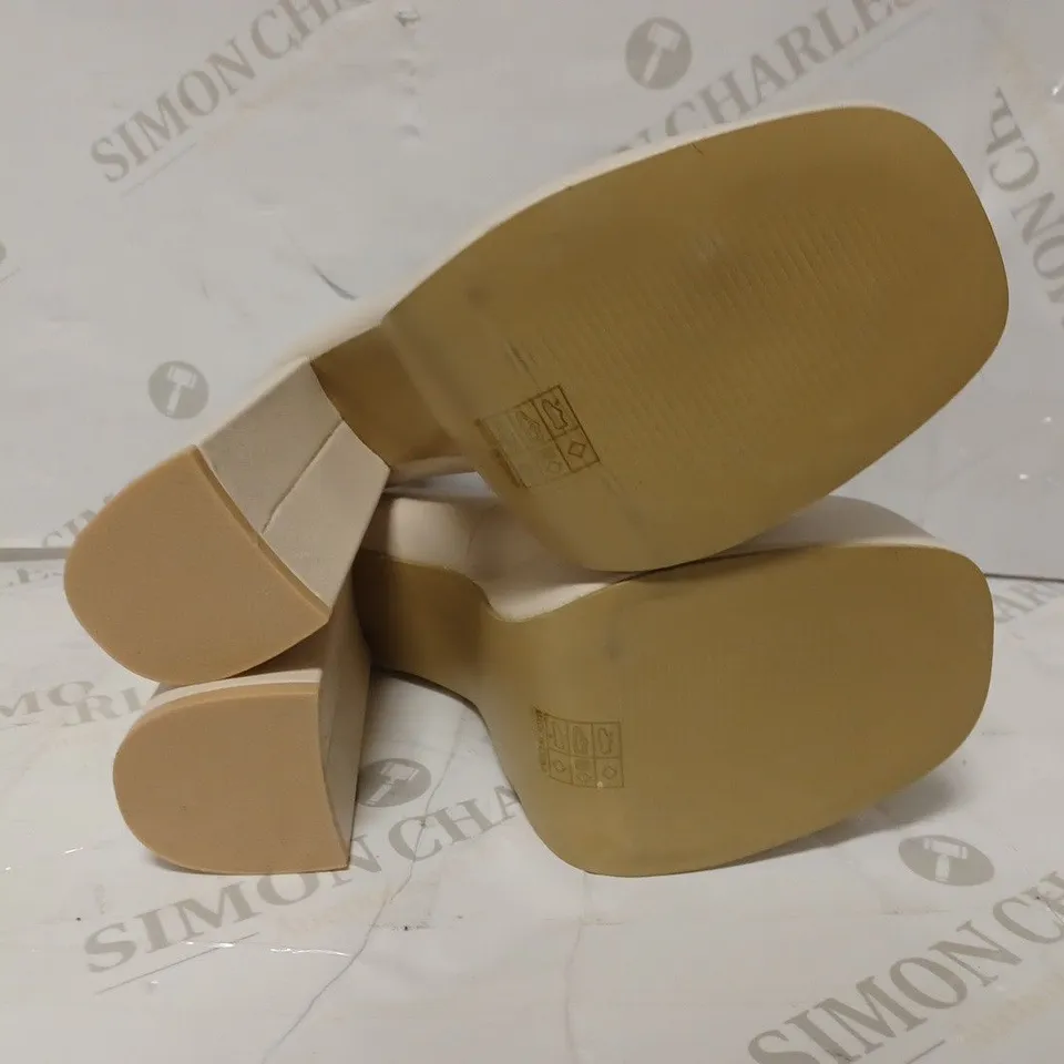 PAIR OF KOI DESIGNER VEGAN STRAP-UP PLATFORM HEELS IN CREAM - SIZE 6