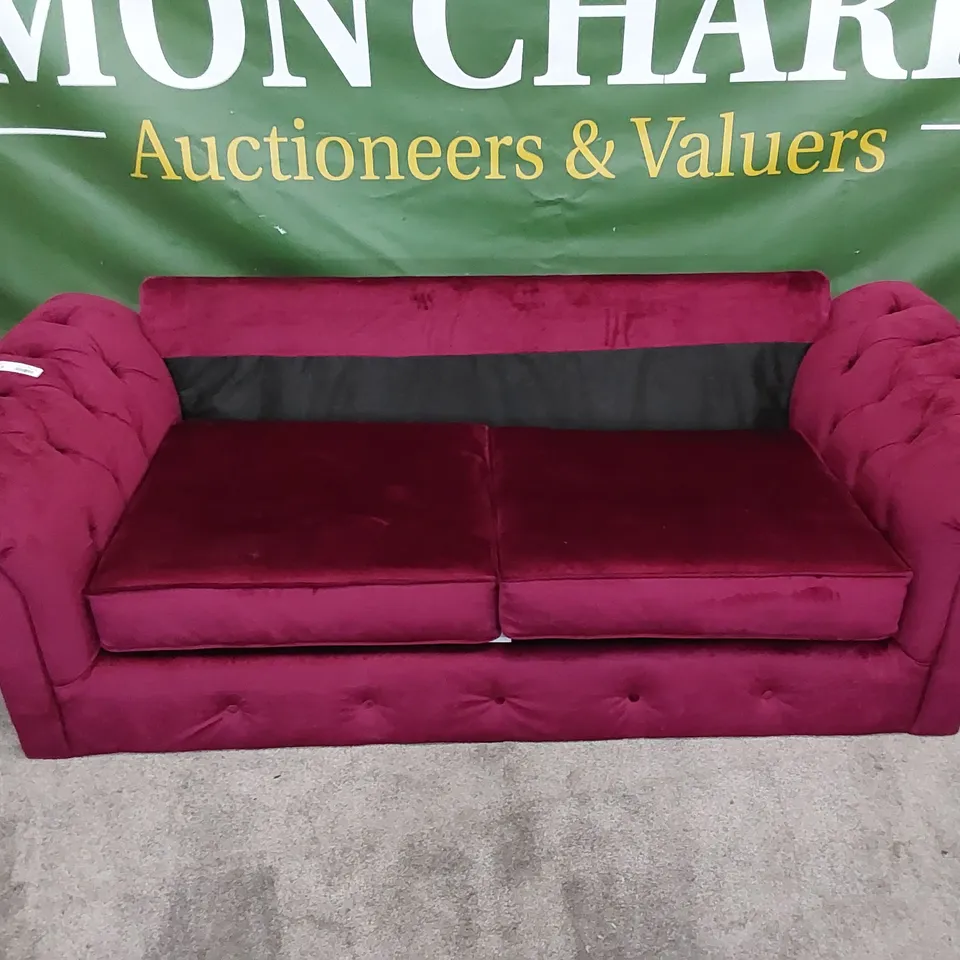 DESIGNER SOFA UPHOLSTERED IN BURGUNDY FABRIC 