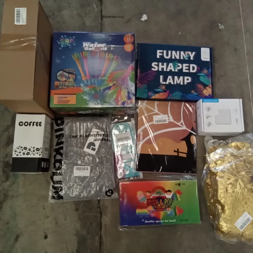PALLET OF ASSORTED ITEMS INCLUDING WATER BALLOONS, FUNNY SHAPED LAMP, COFFEE GRINDER, NOTEBOOK AC ADAPTER, GOLD TINSEL, PUSH & POP FIDGET TOYS