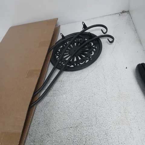 WROUGHT-IRON GARDEN ORNAMENT WITH CIRCULAR LATTICE DISC AND SCROLL ARMS