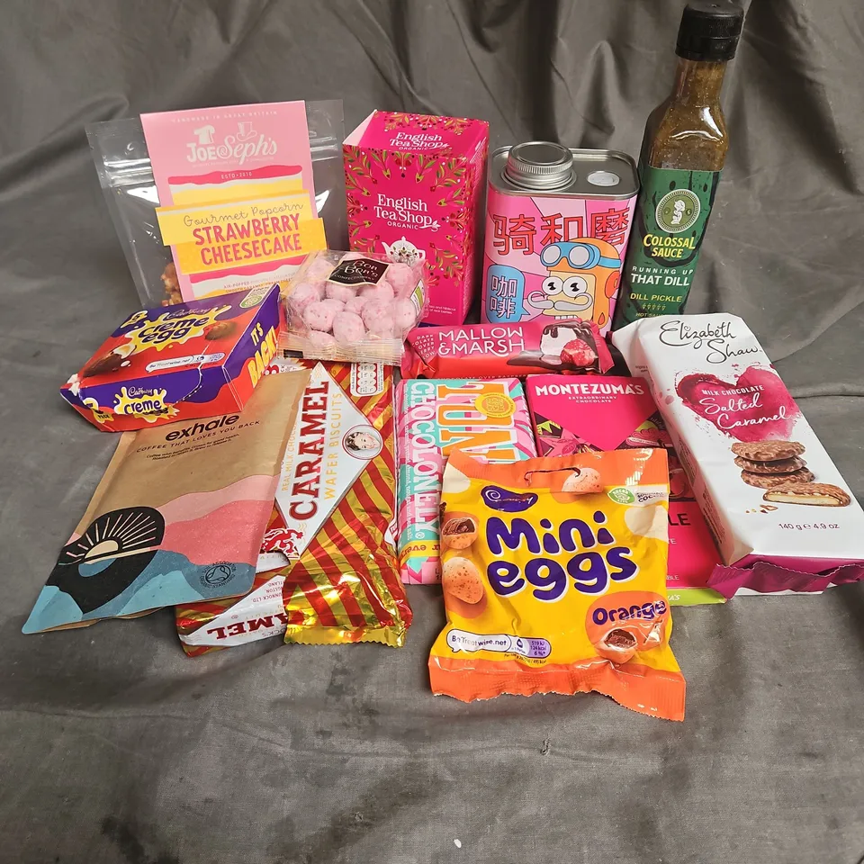 APPROXIMATELY 15 ASSORTED FOOD ITEMS TO INCLUDE - CADBURY CREME EGG, TONY'S CHOCOLONELY, MONTEZUMA'S HOT PICKLE, ETC