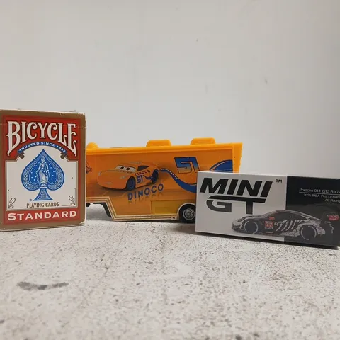 APPROXIMATELY 12 ASSORTED TOYS AND GAMES TO INCLUDE PLAYING CARDS, ETC