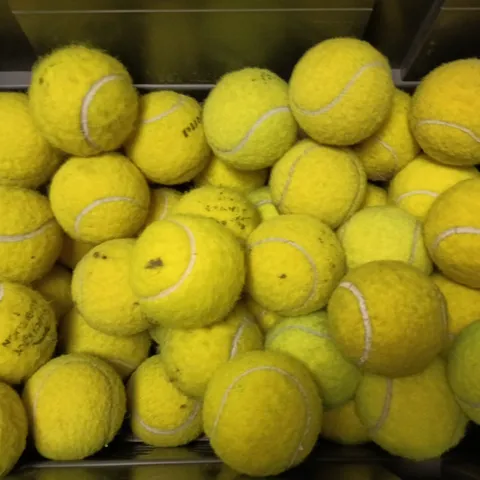 APPROXIMATELY 20 ASSORTED TENNIS BALLS