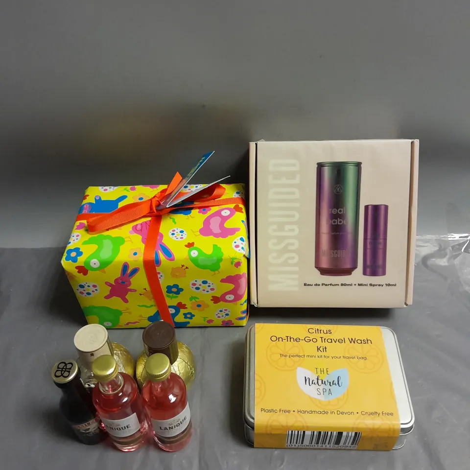 BOX OF APPROX 3 ASSORTED BODY CARE PRODUCTS TO INCLUDE - MISSGUIDED REAL BABE PARFUM SET - THE NATURAL SPA ON-THE-GO TRAVEL WASH KIT - LUSH LET'S BE EGGCELLENT