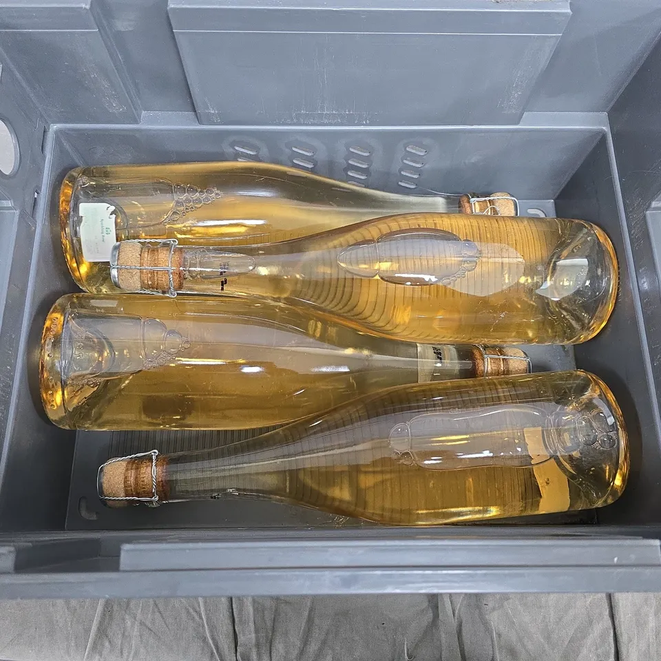 FOUR  BOTTLES OF PALE-GOLD SPARKLING DRINK