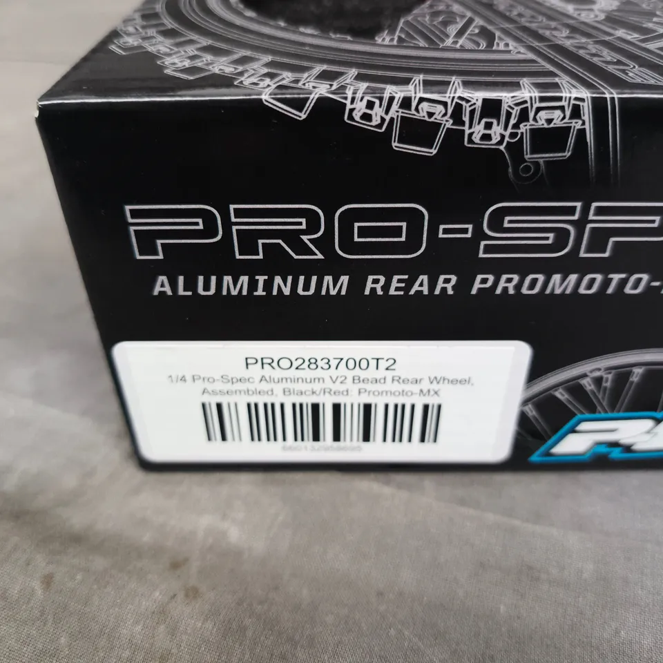PRO-LINE PRO-SPEC ALUMINUM REAR WHEEL FOR PROMOTO-MX, 1/4 SCALE, BEAD, ASSEMBLED (BLACK/RED)