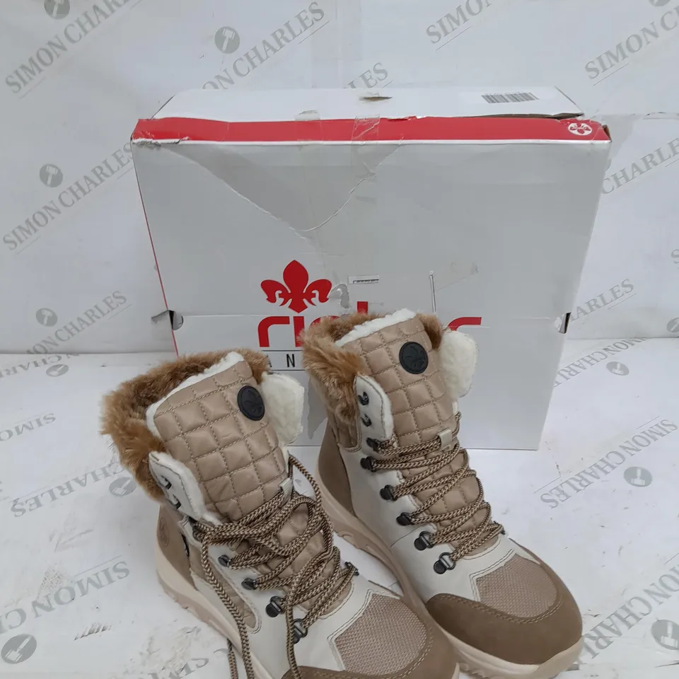 BOXED PAIR OF RIEKER CREAM WINTER FUR HIKE BOOTS IN SIZE 5 
