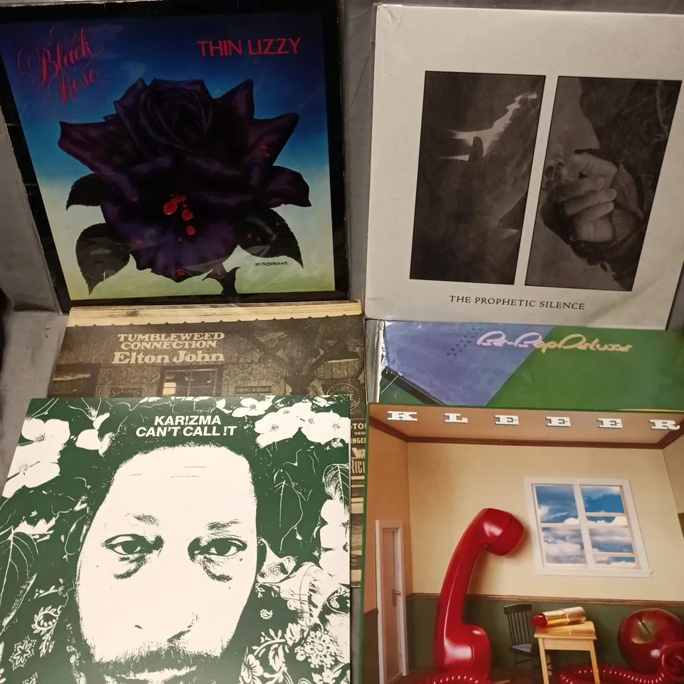 APPROXIMATELY 12 ASSORTED VINYLS TO INCLUDE ARTISTS SUCH AS THIN LIZZY, ELTON JOHN, DIRE STRAITS, ETC - COLLECTION ONLY