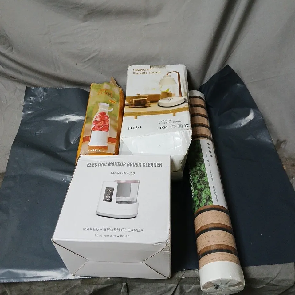 BOX OF APPROXIMATELY 20 ASSORTED ITEMS TO INCLUDE MINI JUICER, CANDLE LAMP, WALLPAPER, ELECTRIC MAKE UP BRUSH CLEANER ETC