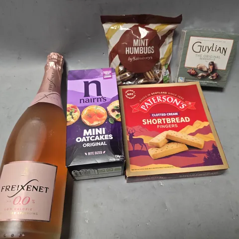 APPROXIMATELY 12 ASSORTED FOOD & DRINK ITEMS TO INCLUDE - GUYLIAN SEASHELLS CHOCOLATE , FREIXENET 0.0% ALC ETC