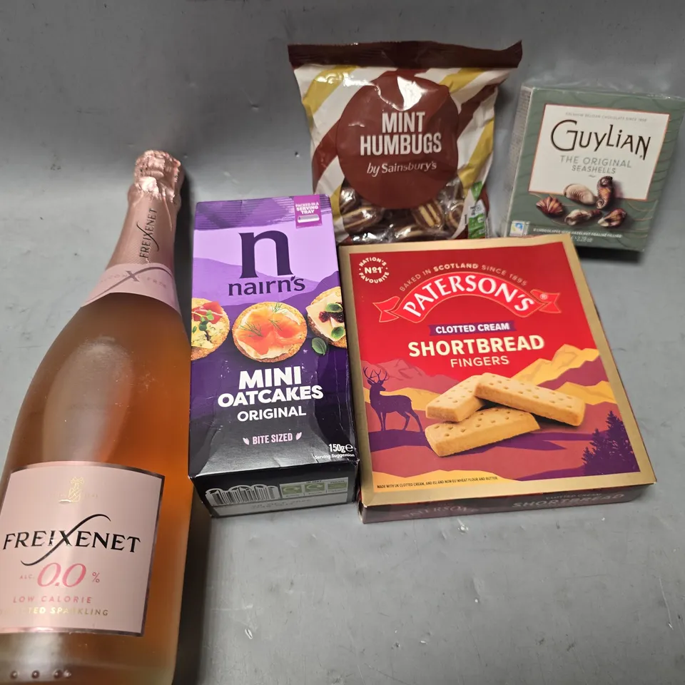 APPROXIMATELY 12 ASSORTED FOOD & DRINK ITEMS TO INCLUDE - GUYLIAN SEASHELLS CHOCOLATE , FREIXENET 0.0% ALC ETC