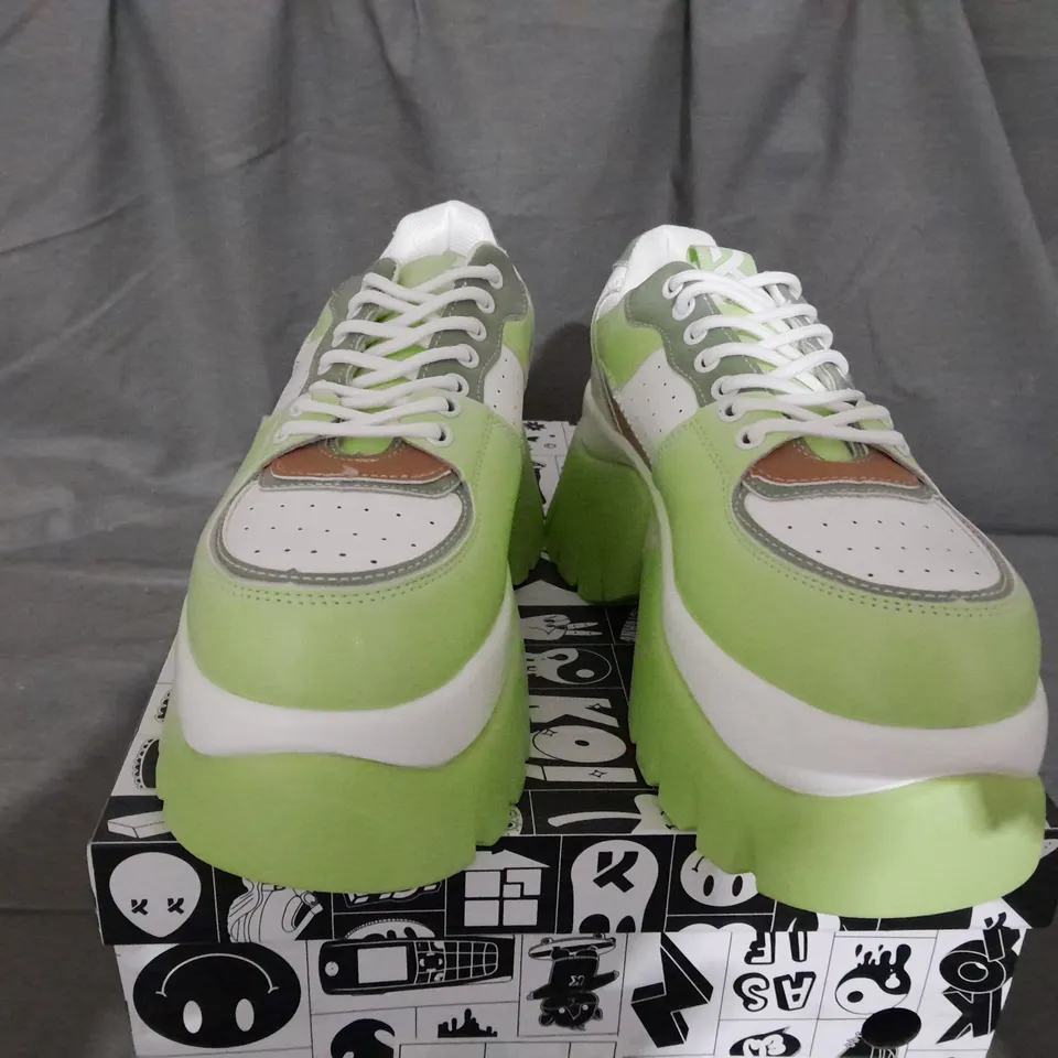 BOXED PAIR OF KOI KIWI JUICE TRAINERS IN GREEN SIZE 6 