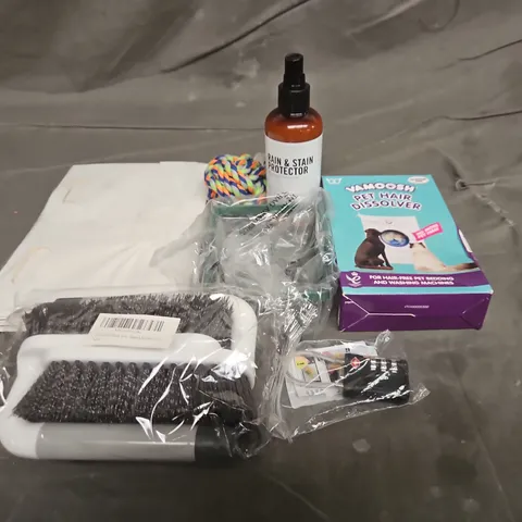 TOTE OF APPROXIMATELY 10 ASSORTED HOUSEHOLD ITEM TO INCLUDE DOG TOYS, BRUSHES AND RAIN AND STAIN PROTECTOR