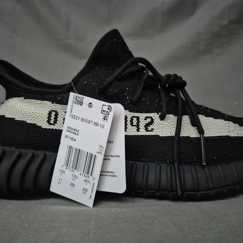 PAIR OF ADIDAS YEEZY BOOST 350 V2 SHOES IN BLACK/CREAM UK SIZE 10.5