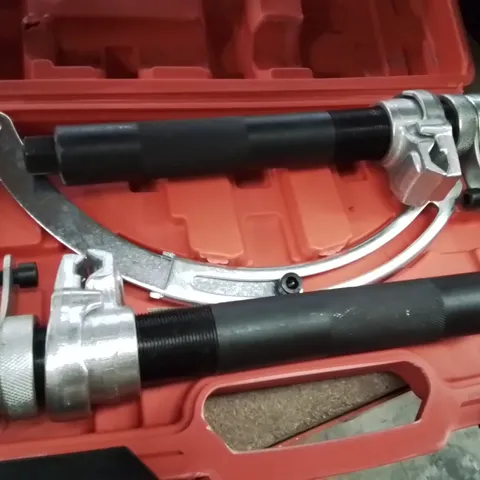 BOXED SET OF HEAVY-DUTY COIL SPRING COMPRESSORS.