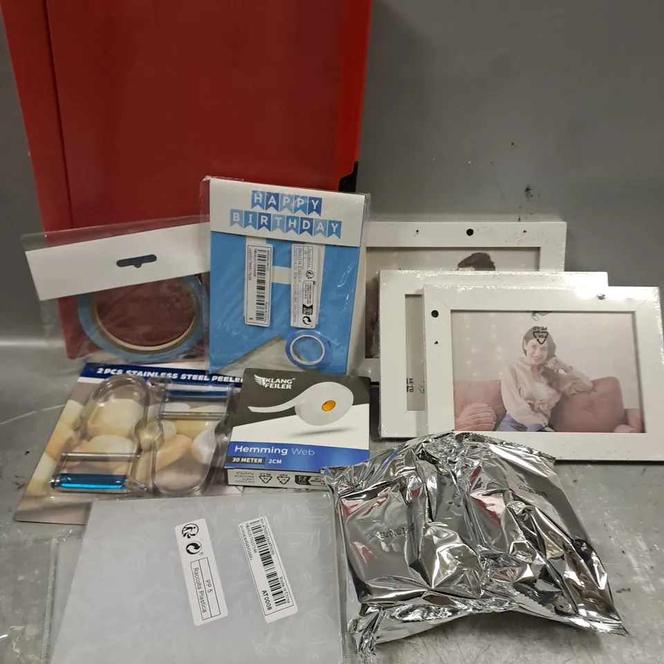 ASSORTED HOUSEHOLD ITEMS TO INCLUDE PHOTO FRAMES, HEMMING WEB, FOOD PEELER, ETC 