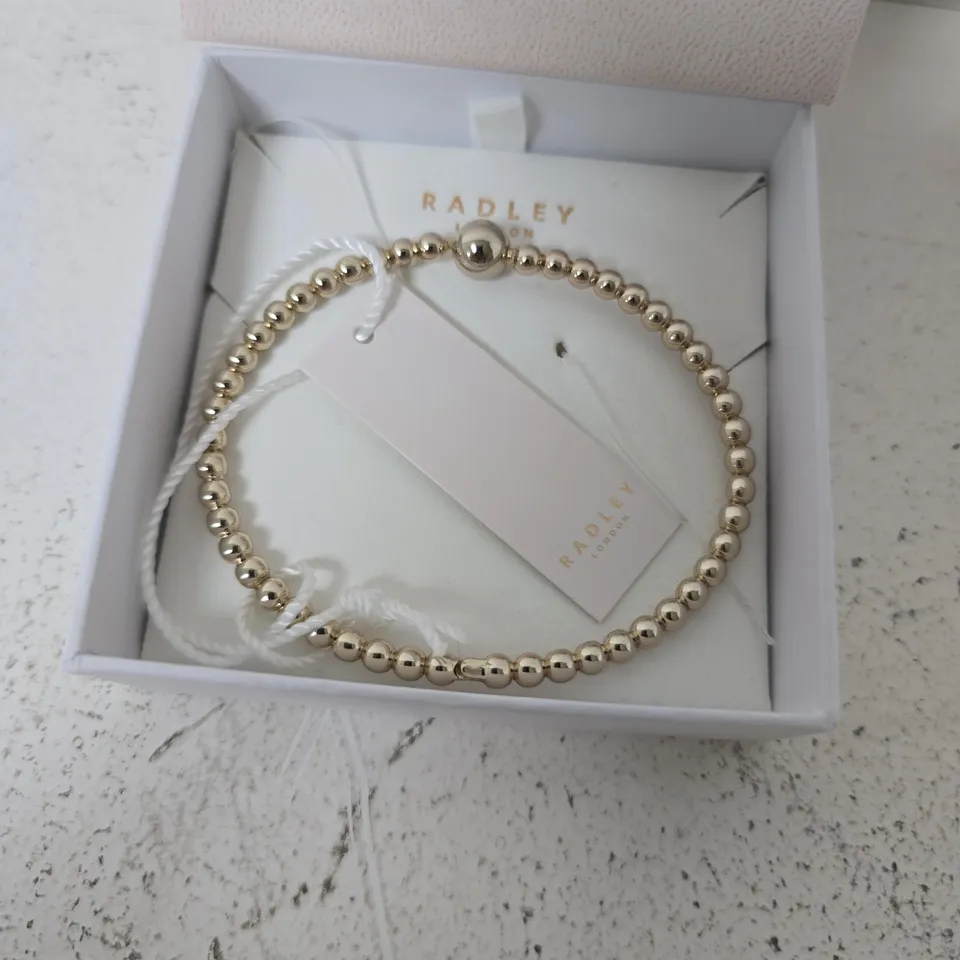 BOXED RADLEY 18CT GOLD PLATED BEAD HINGED BANGLE