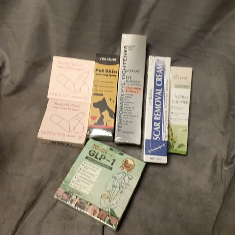 APPROXIMATELY 15 ASSORTED COSMETICS ITEMS TO INCLUDE SCAR REMOVAL CREAM, STAMP EYELINER, HERBAL PURIFIER, ETC