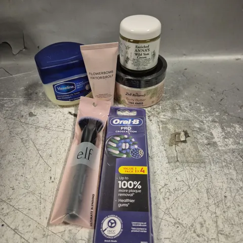 APPROXIMATELY 20 HEALTH AND BEAUTY PRODUCTS TO INCLUDE FLOWERBOMB VIKTOR & ROLF BODY LOTION, ELF BLENDING BRUSH AND VASELINE PROTECTING JELLY