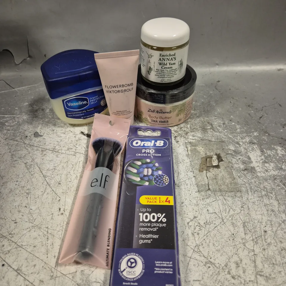 APPROXIMATELY 20 HEALTH AND BEAUTY PRODUCTS TO INCLUDE FLOWERBOMB VIKTOR & ROLF BODY LOTION, ELF BLENDING BRUSH AND VASELINE PROTECTING JELLY