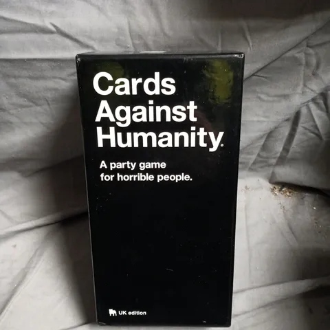 CARDS AGAINST HUMANITY UK EDITION – PARTY CARD GAME (BOXED)