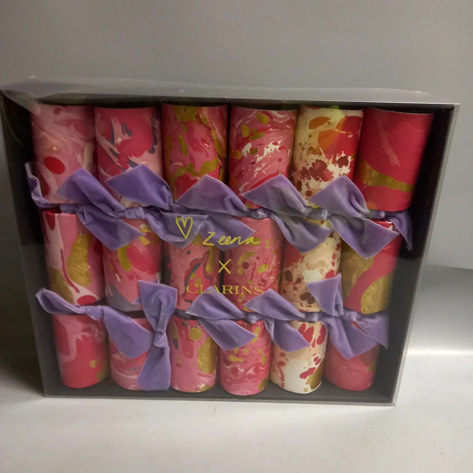 BOXED CLARINS CHRISTMAS CRACKER GIFT SET INCLUDES A CLARINS PRODUCT