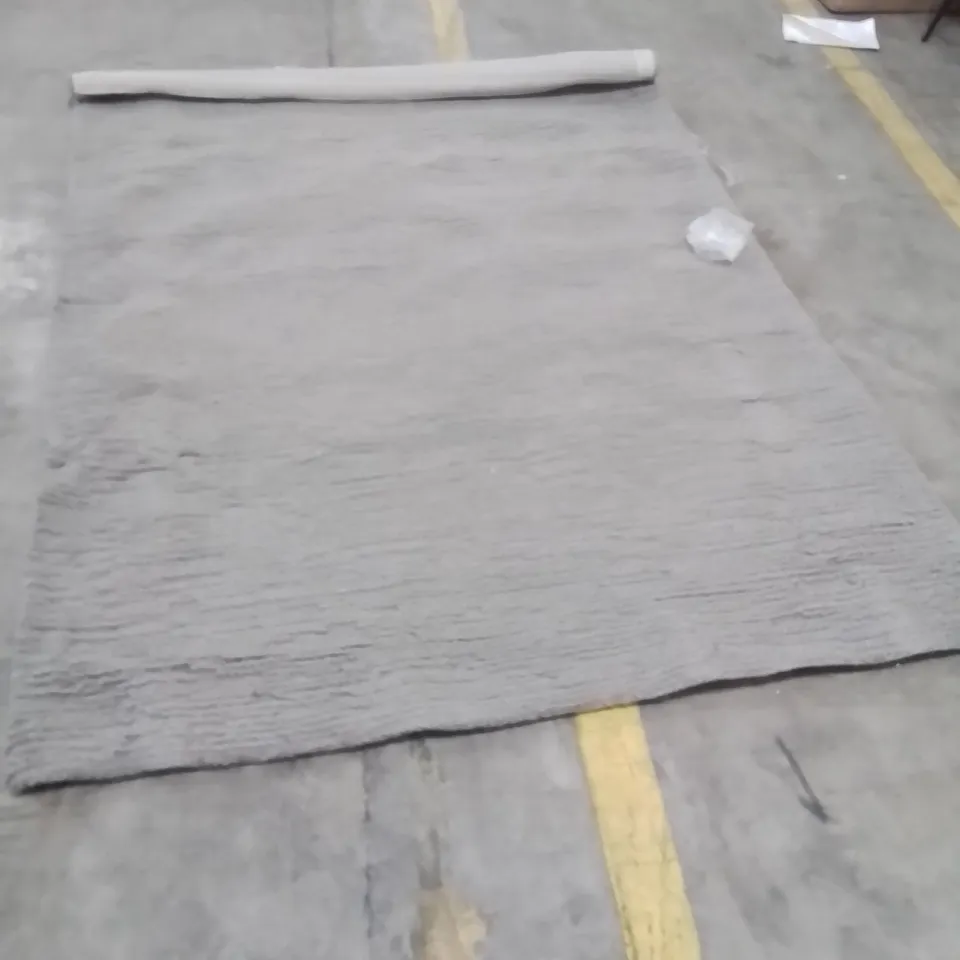 STILLAGE OF APPROXIMATELY 15 QUALITY DESIGNER RUGS