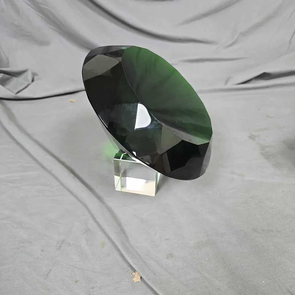 GREEN FACETED GLASS GEM SCULPTURE ON CLEAR ACRYLIC BASE