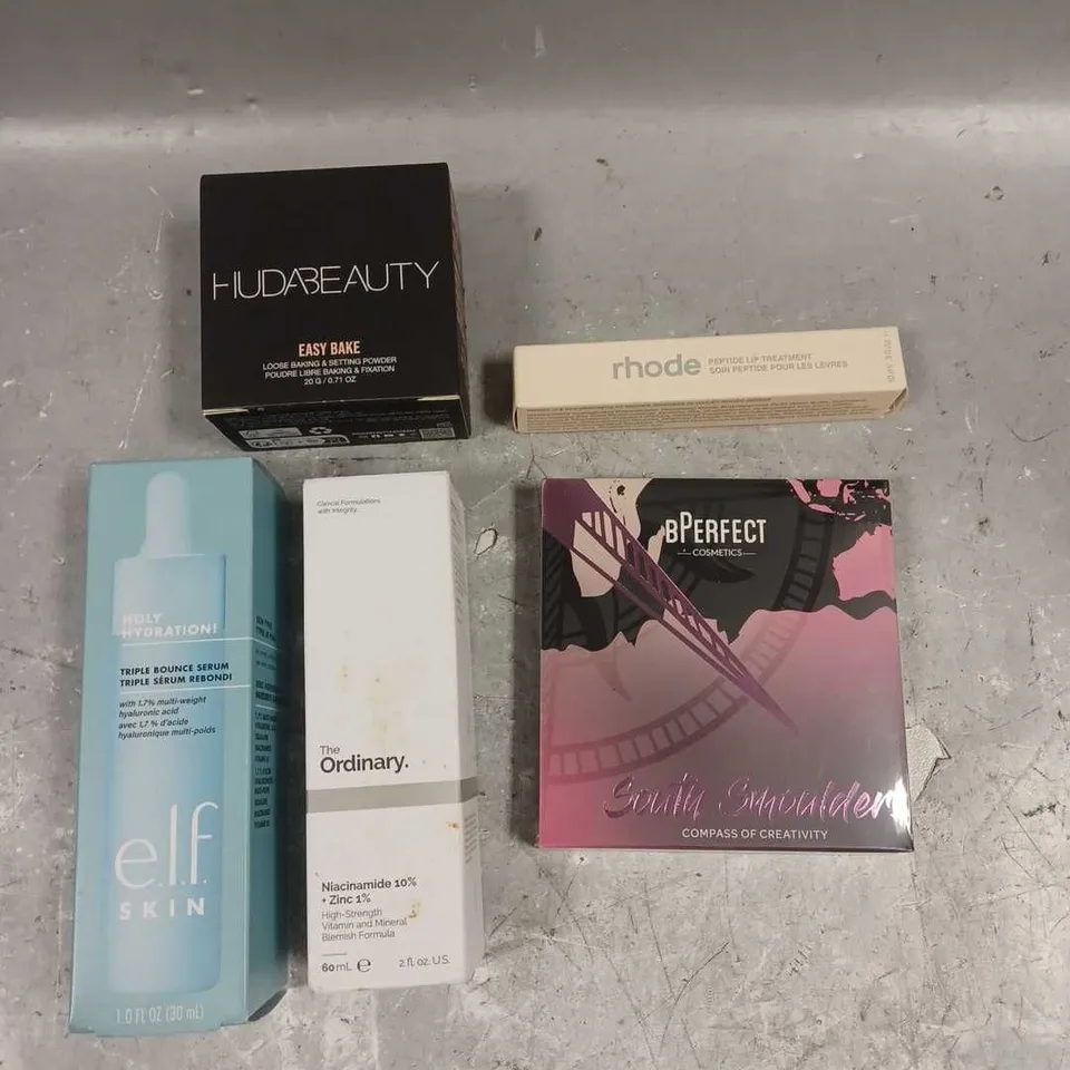 LOT OF 5 ASSORTED COSMETIC PRODUCTS TO INCLUDE - HUDABEAUTY EASY BAKE SETTING POWDER  - BPERFECT SOUTH SMOULDERS PALETTE - RHODE PEPTIDE LIP TREATMENT - ETC