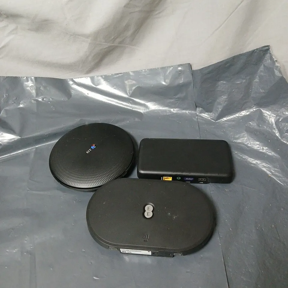 APPROXIMATELY 12 ASSORTED HOUSEHOLD ITEMS TO INCLUDE ROUTERS, PLUGS, REMOTE CONTROLS ETC