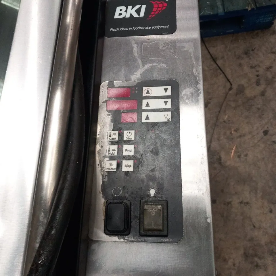 BKI ROTISSERIE OVEN ON METAL STAND