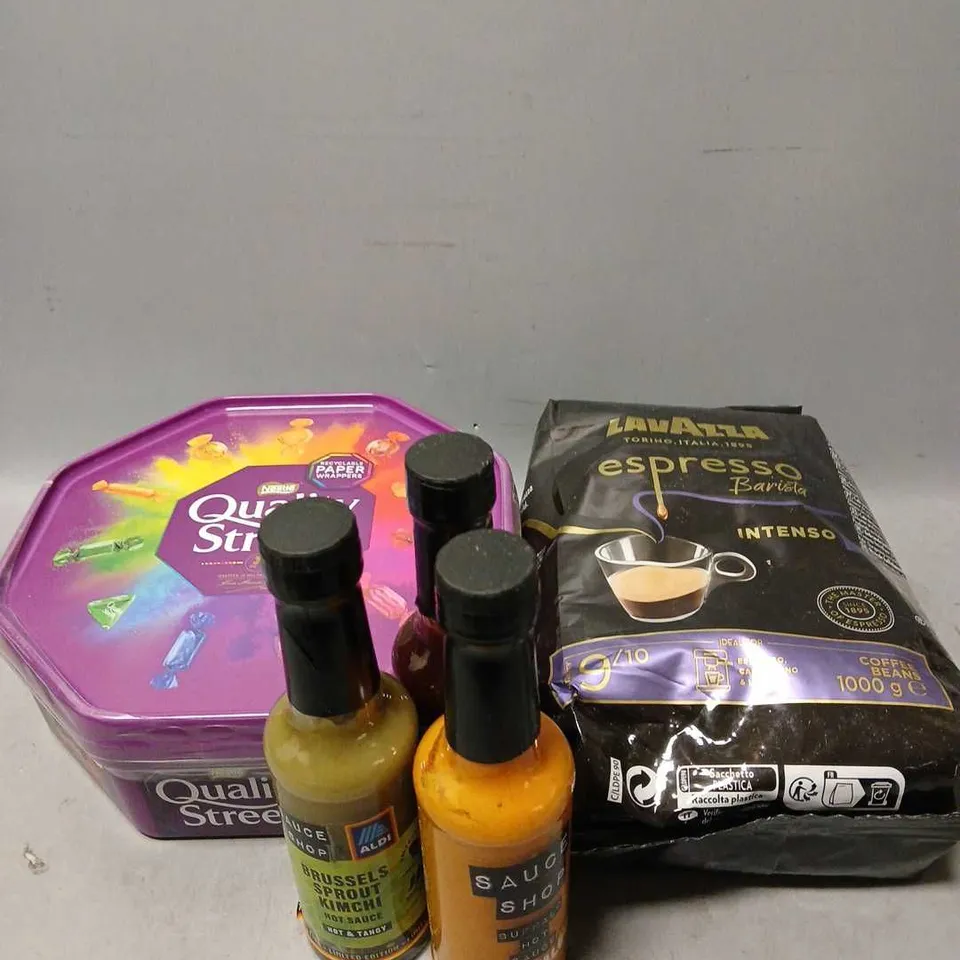 TOTE OF ASSORTED FOOD AND DRINK ITEMS TO INCLUDE QUALITY STREETS, LAVAZZA AND HOT SAUCES