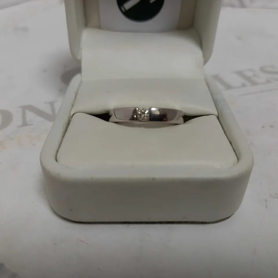 DESIGNER 18CT WHITE GOLD SOLITAIRE RING TENSION SET WITH A DIAMOND