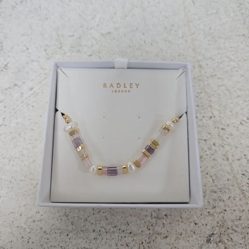 RADLEY LONDON BEADED BRACELET – PINK, PURPLE & CLEAR BEADS WITH GOLD-TONE SPACERS
