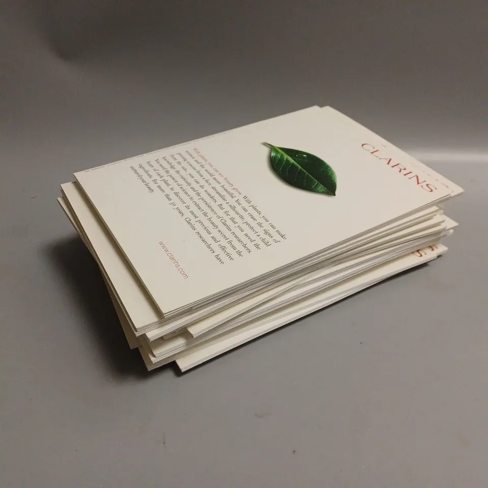 APPROXIMATELY 20 CLARINS BLANK WHITE SHEET NOTEBOOKS 