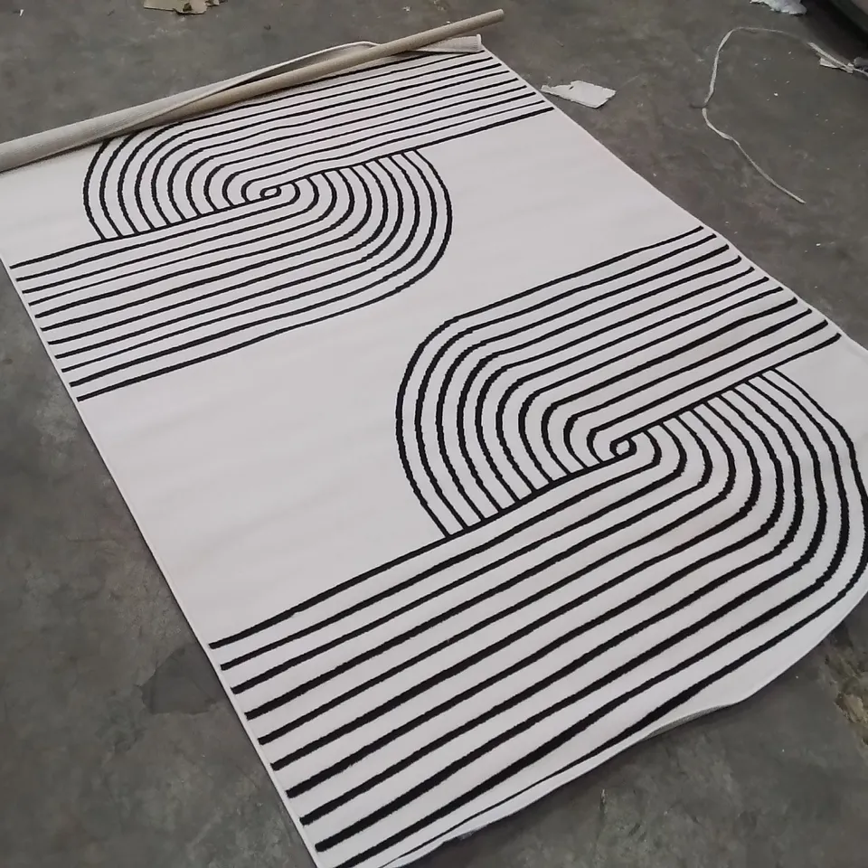 STILLAGE OF APPROXIMATELY 18 QUALITY DESIGNER RUGS