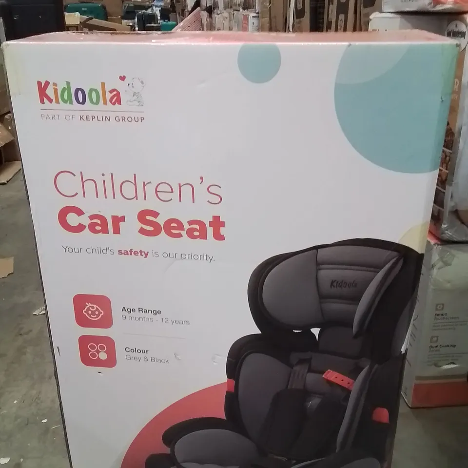 BOXED KIDOOLA CHILDREN'S CAR SEAT