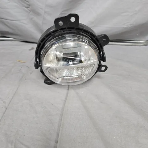 ROUND CAR HEADLIGHT ASSEMBLY WITH BLACK MOUNTING FRAME