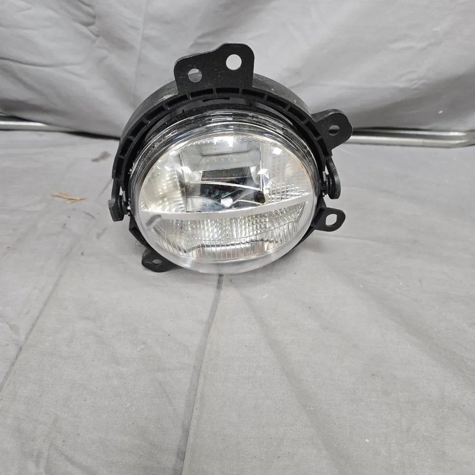 ROUND CAR HEADLIGHT ASSEMBLY WITH BLACK MOUNTING FRAME
